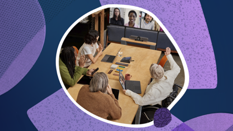 People in a meeting, some in person and others remotely via video conference.