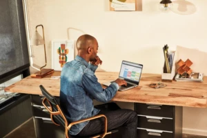Man interacting with a Huawei MateBook laptop.
