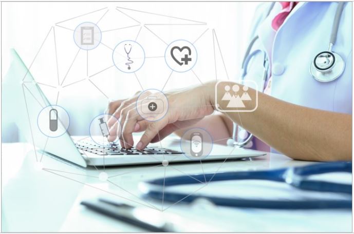 An image of a doctor using a computer.