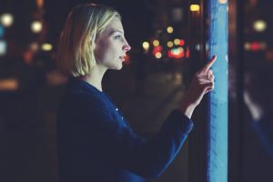 Woman interacting with a smart screen