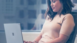 Woman working on a Surface device.