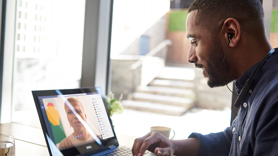 A remote worker in a Teams meeting on his laptop.