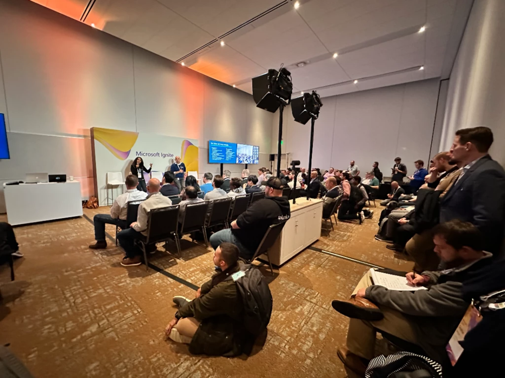 A roomful of attendees at an Ignite breakout session.