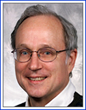Butler Lampson wearing glasses and smiling at the camera