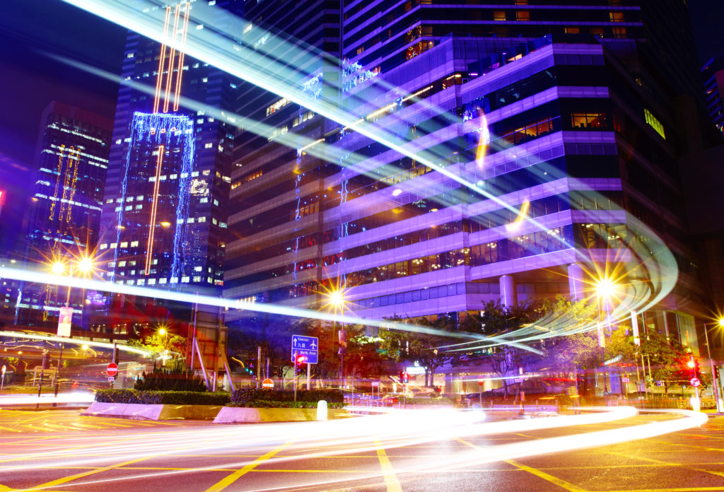 Fast moving car trail in city at night