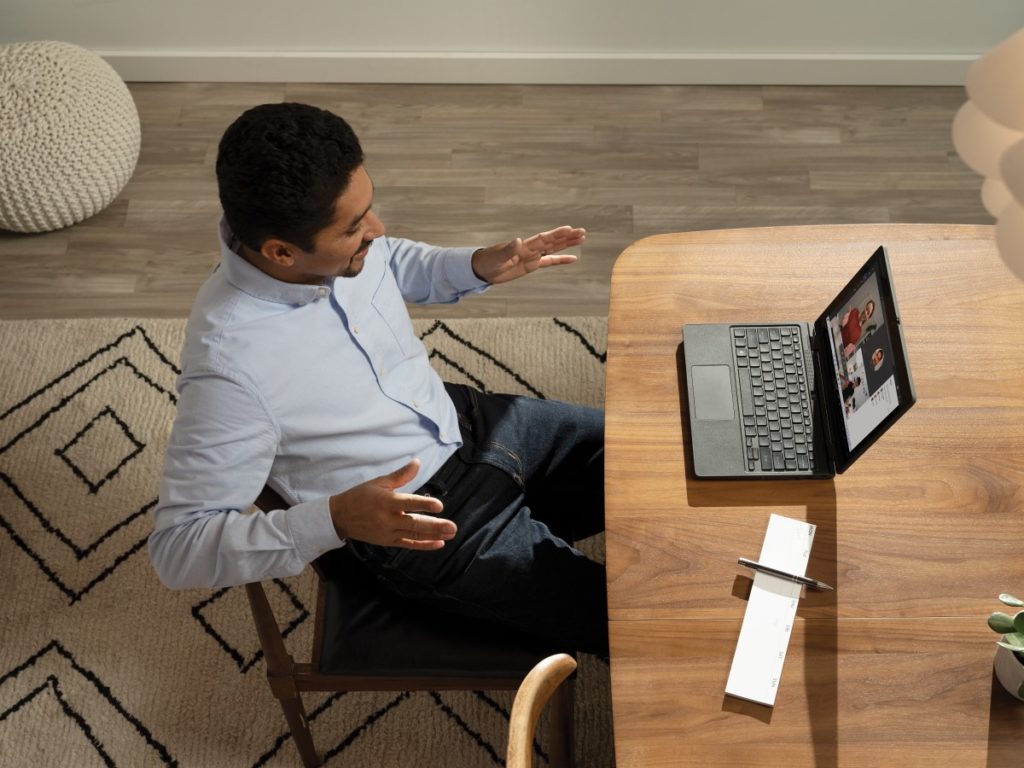 Male teacher with online class with Acer TravelMate B311 2-in-1.