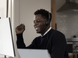 Adult male inside using Microsoft Modern USB Headset.