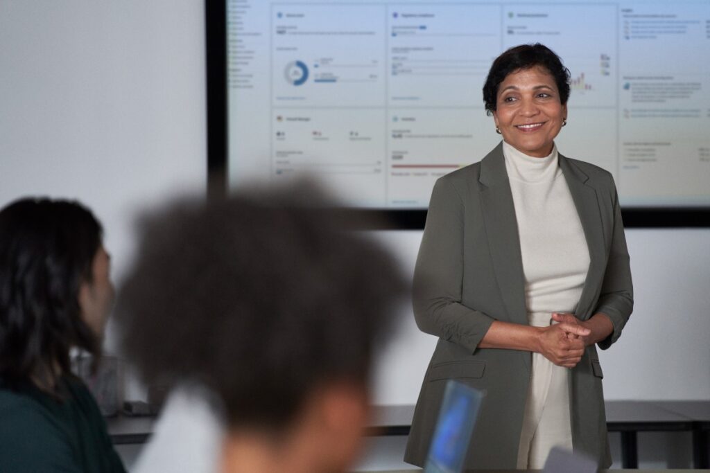 C I S O presents to the board of executives on security topics in a conference room setting.