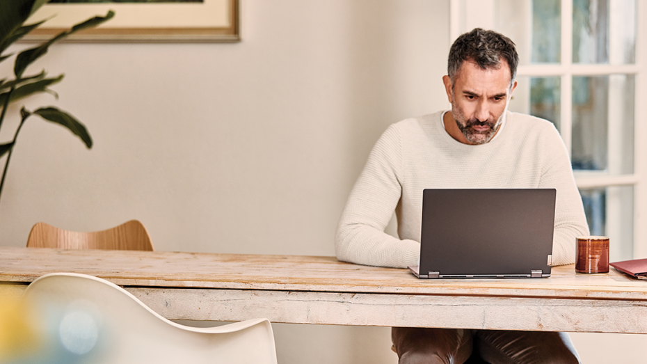 Image of a remote worker at his laptop.
