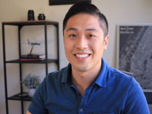 Po poses for a photo in his home office. 