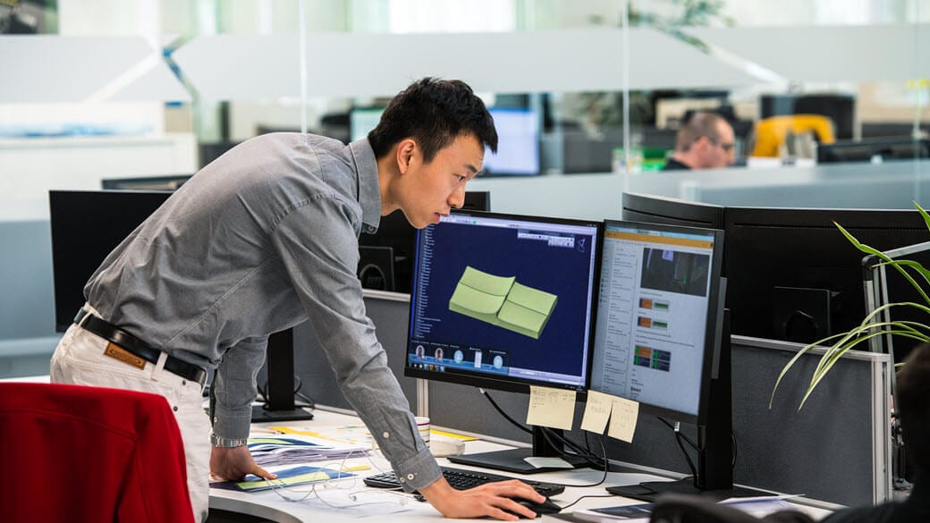 An engineer works at his desk in office.