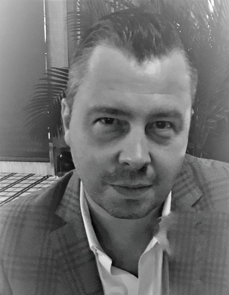 Kerametlian smiles in a corporate photo.